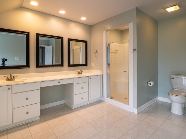 modern bathroom renovation,large format tiles,contemporary bathroom lighting